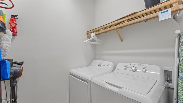 washroom featuring washer and dryer