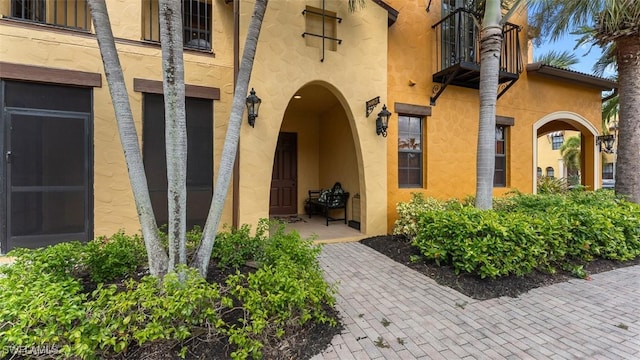 entrance to property with a balcony