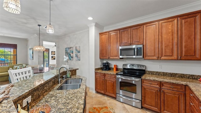 kitchen with ceiling fan, sink, pendant lighting, stone countertops, and appliances with stainless steel finishes