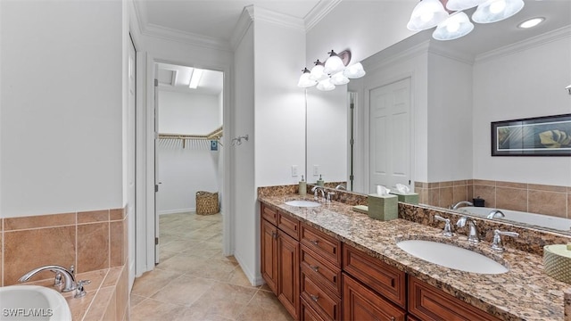 bathroom with tiled tub, tile patterned flooring, vanity, and ornamental molding