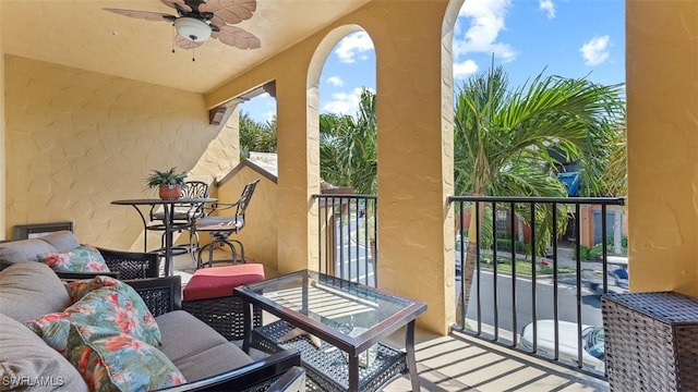 balcony with ceiling fan and an outdoor hangout area