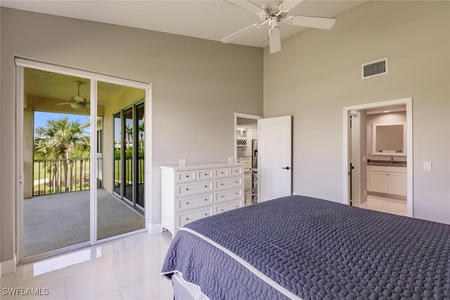 tiled bedroom with ceiling fan and access to exterior