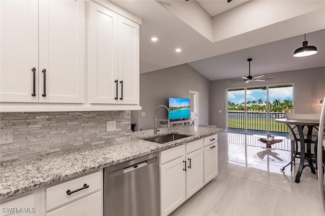 kitchen with ceiling fan, dishwasher, light stone countertops, sink, and backsplash