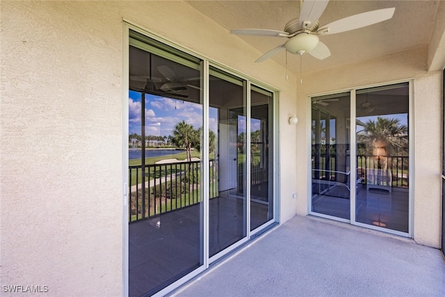 exterior space featuring ceiling fan