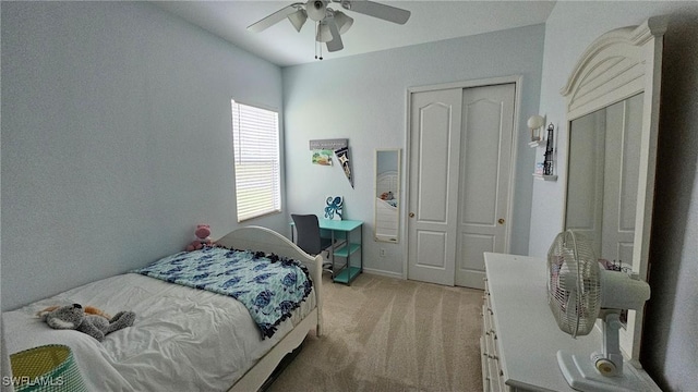 bedroom featuring ceiling fan, a closet, and carpet floors