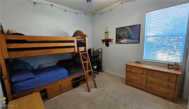 bedroom featuring light carpet