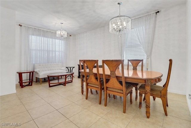 tiled dining space with a notable chandelier