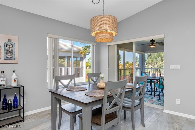 dining space featuring vaulted ceiling and ceiling fan