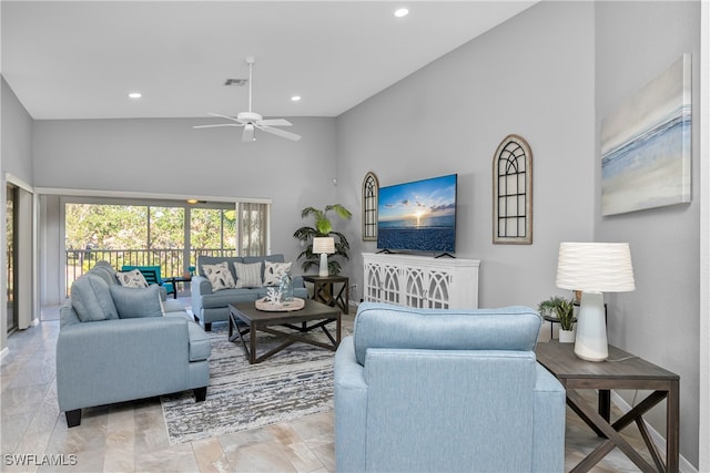 living room featuring high vaulted ceiling and ceiling fan