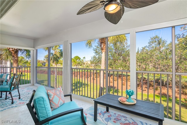 sunroom / solarium featuring ceiling fan