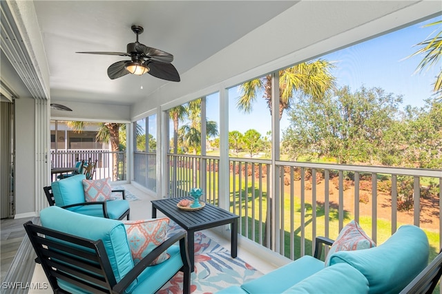 sunroom featuring ceiling fan