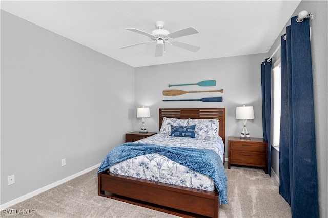 bedroom with ceiling fan and light colored carpet