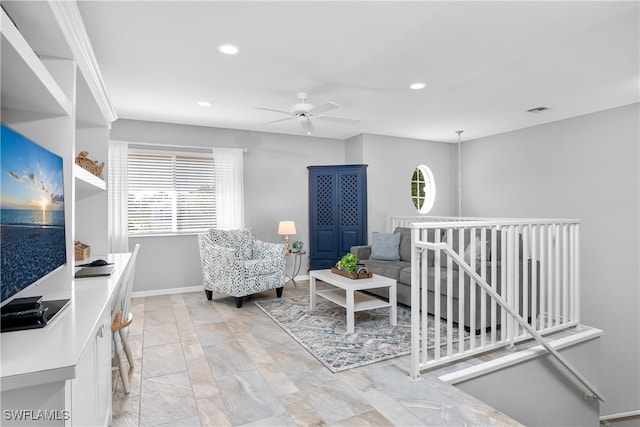 interior space with ceiling fan