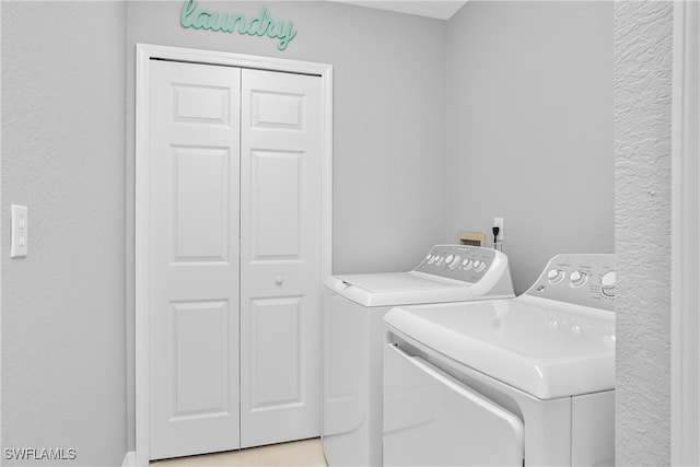 laundry area with separate washer and dryer