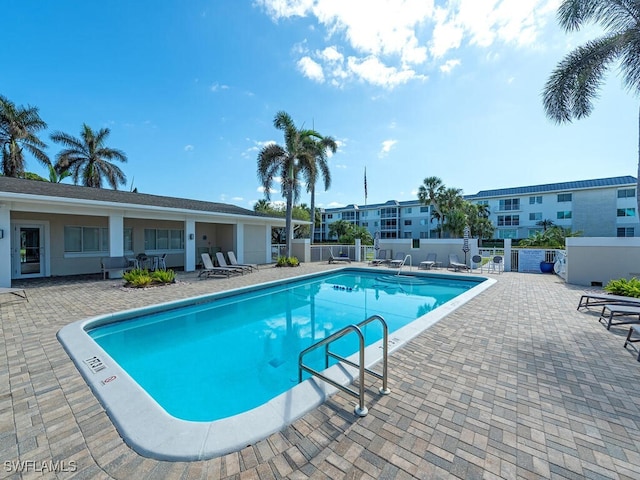 view of swimming pool featuring a patio