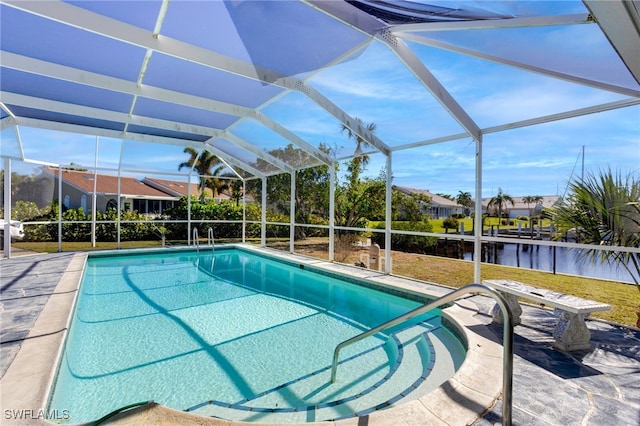 view of swimming pool featuring a patio, a water view, and a lanai