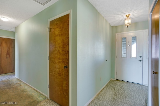 2711 W Marion Ave, Punta Gorda, FL 33950 - foyer entrance with a textured ceiling and a chandelier