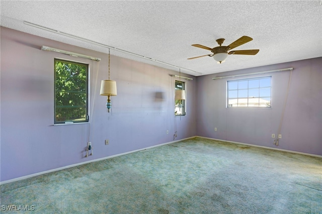 2711 W Marion Ave, Punta Gorda, FL 33950 - spare room with a textured ceiling, carpet floors, and ceiling fan