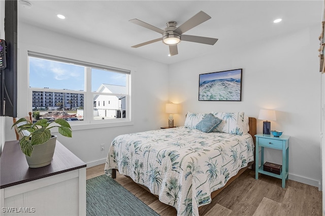 bedroom featuring hardwood / wood-style floors and ceiling fan