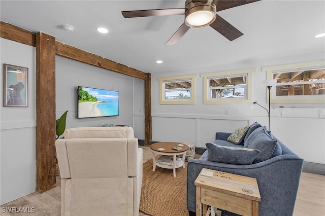 living room featuring ceiling fan and light wood-type flooring