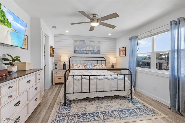 bedroom featuring light hardwood / wood-style flooring and ceiling fan