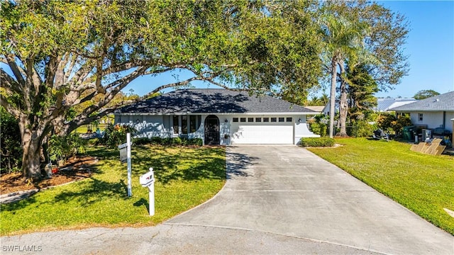 ranch-style house with a front yard and a garage