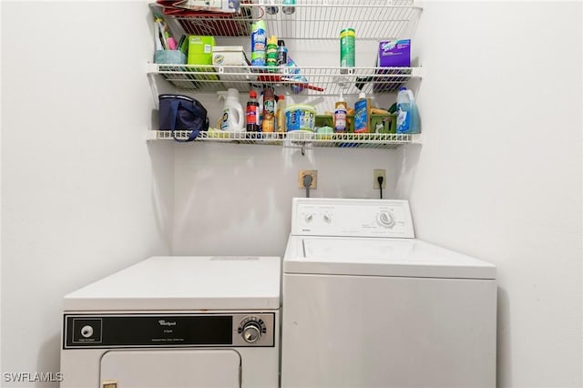 washroom featuring washing machine and dryer