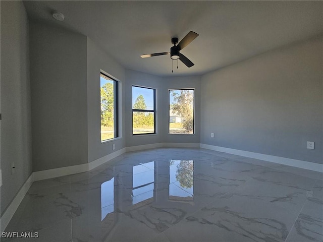 unfurnished room featuring ceiling fan