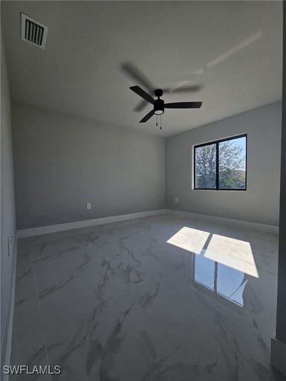 spare room featuring ceiling fan