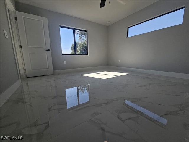 unfurnished room featuring ceiling fan