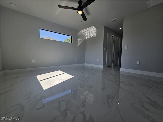 unfurnished room featuring ceiling fan