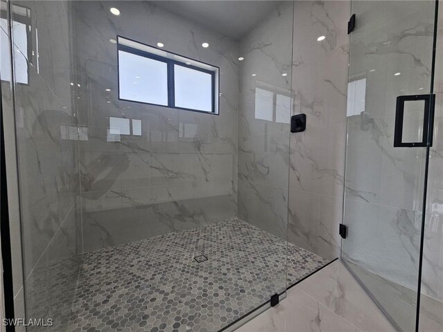 bathroom featuring an enclosed shower