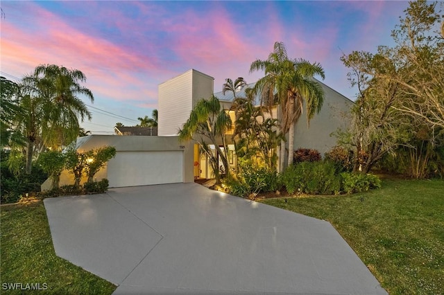 view of front of property with a lawn