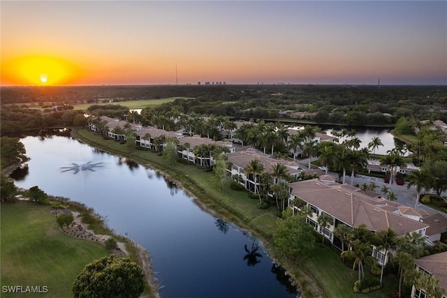 aerial view at dusk with a water view