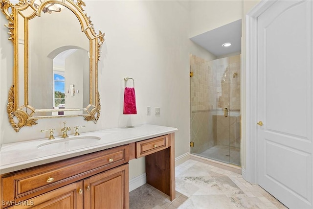 bathroom featuring vanity and an enclosed shower