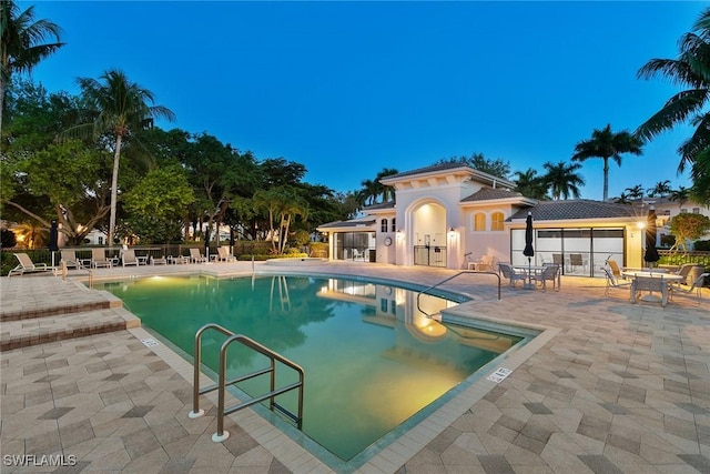 view of swimming pool with a patio