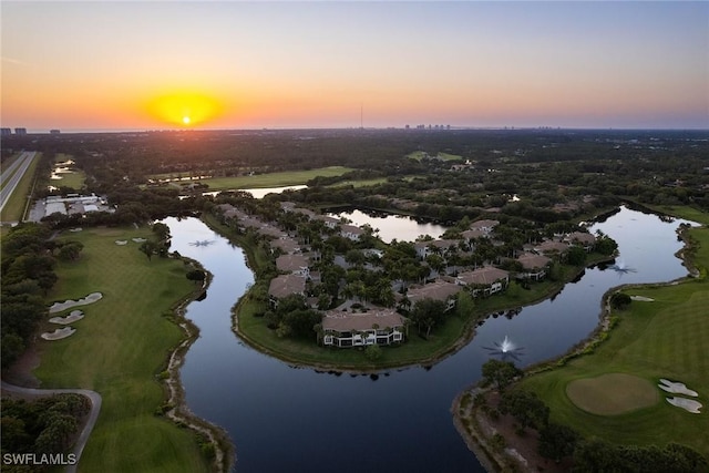 aerial view at dusk with a water view