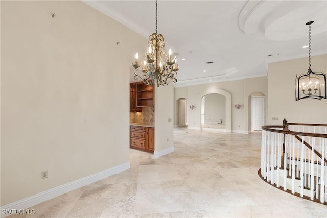 empty room with crown molding, baseboards, recessed lighting, arched walkways, and a notable chandelier