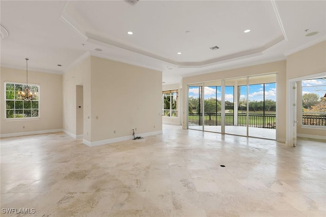 unfurnished room featuring crown molding, baseboards, a raised ceiling, and an inviting chandelier