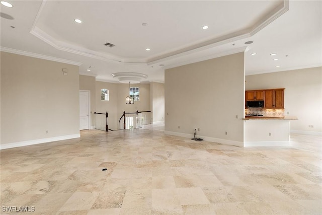 unfurnished living room with recessed lighting, crown molding, a raised ceiling, and baseboards