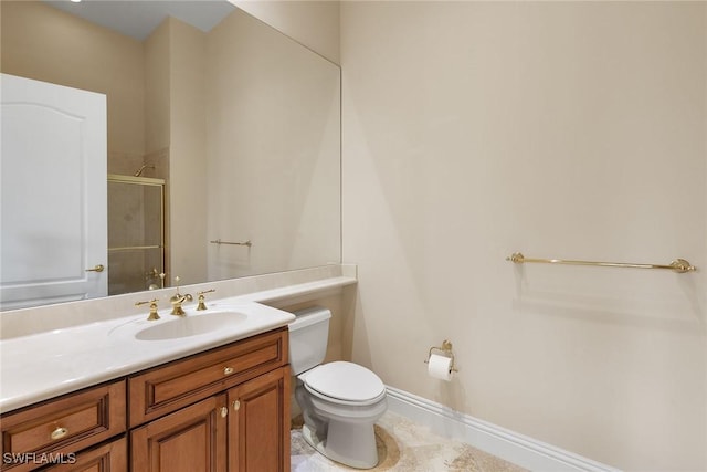 bathroom with an enclosed shower, baseboards, toilet, and vanity