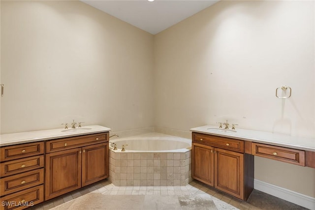 full bathroom featuring vanity, a garden tub, and tile patterned flooring