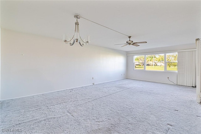 6102 Augusta Dr Unit 103, Fort Myers, FL 33907 - carpeted empty room with a chandelier, ceiling fan, and baseboards