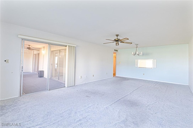 6102 Augusta Dr Unit 103, Fort Myers, FL 33907 - carpeted spare room featuring a chandelier, a ceiling fan, and baseboards