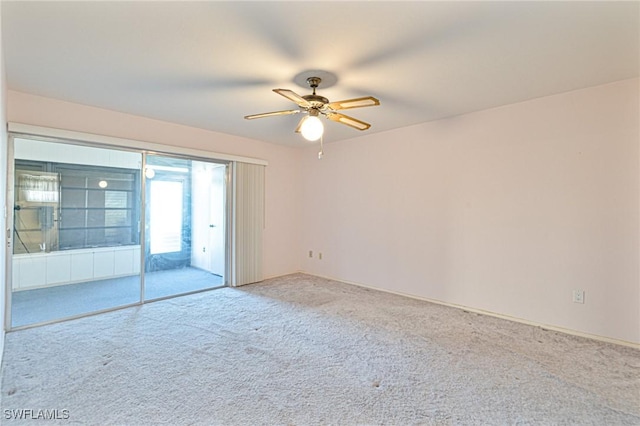 6102 Augusta Dr Unit 103, Fort Myers, FL 33907 - empty room with carpet floors and ceiling fan