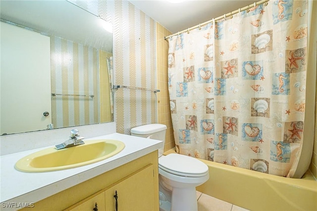 6102 Augusta Dr Unit 103, Fort Myers, FL 33907 - bathroom featuring toilet, vanity, shower / bathtub combination with curtain, tile patterned flooring, and wallpapered walls
