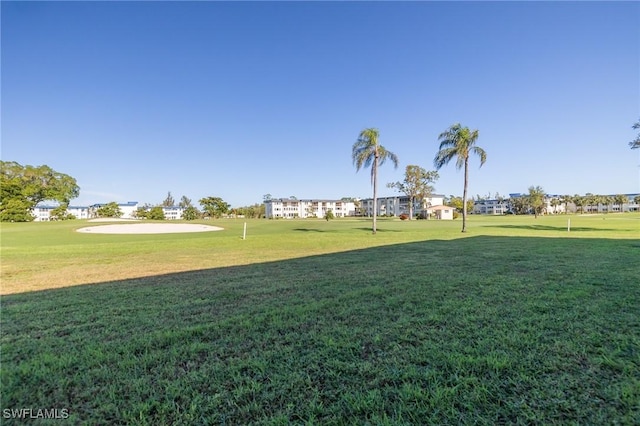 6102 Augusta Dr Unit 103, Fort Myers, FL 33907 - surrounding community with an area to practice putting and a yard