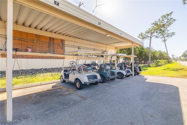 view of parking featuring a carport and a yard