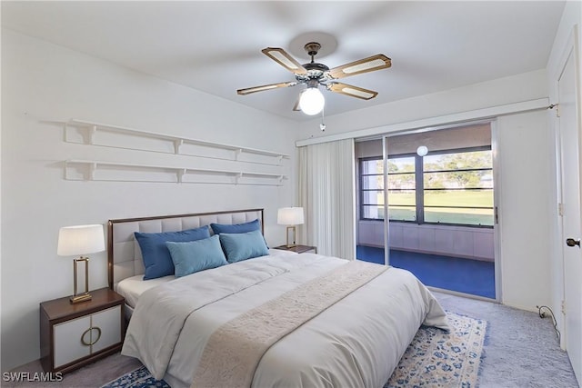 bedroom featuring ceiling fan and carpet