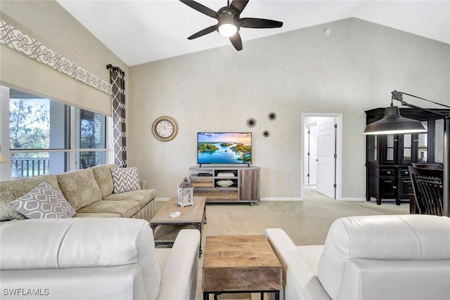 carpeted living room featuring ceiling fan and high vaulted ceiling